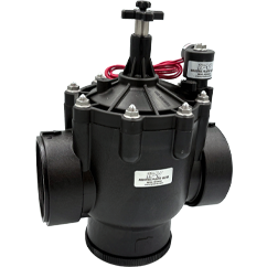 Industrial pressure regulator valve with two large pipe connections and a red hose on top