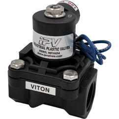 Electrical solenoid valve in black plastic body with blue wires and a 'VITON' label, used to control fluid flow in piping.